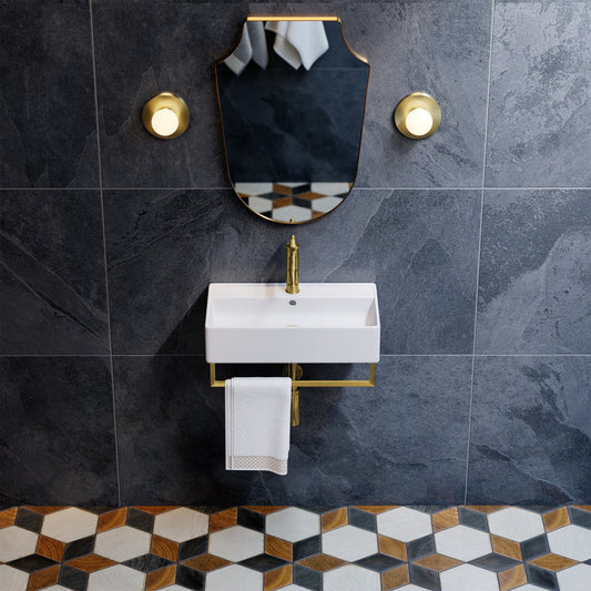 Wall mounted sink with gold towel bar